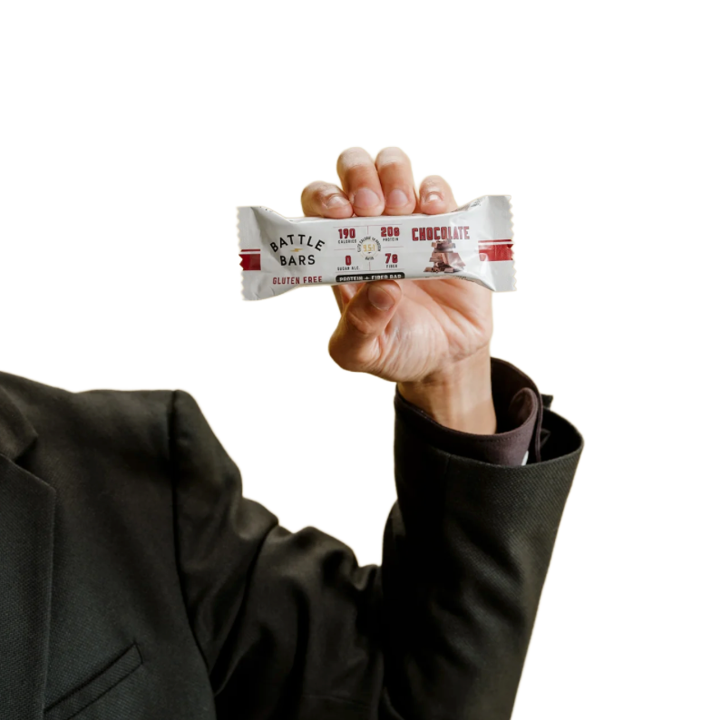 Hand holding a Battle Bars Chocolate bar