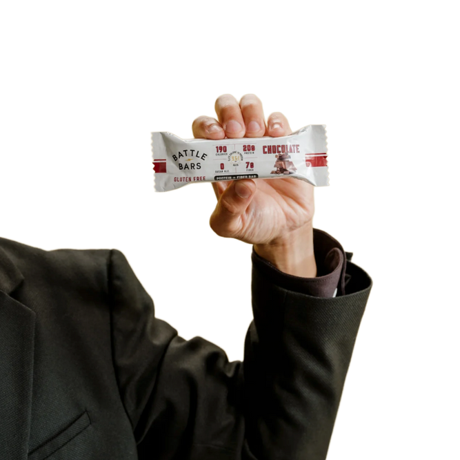 Hand holding a Battle Bars Chocolate bar